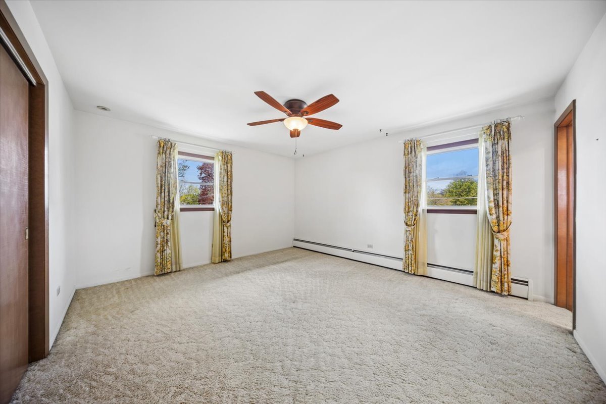 2316 185th Place Lansing, IL 60438 - Photo 11 of 21 a view of an empty room with a window