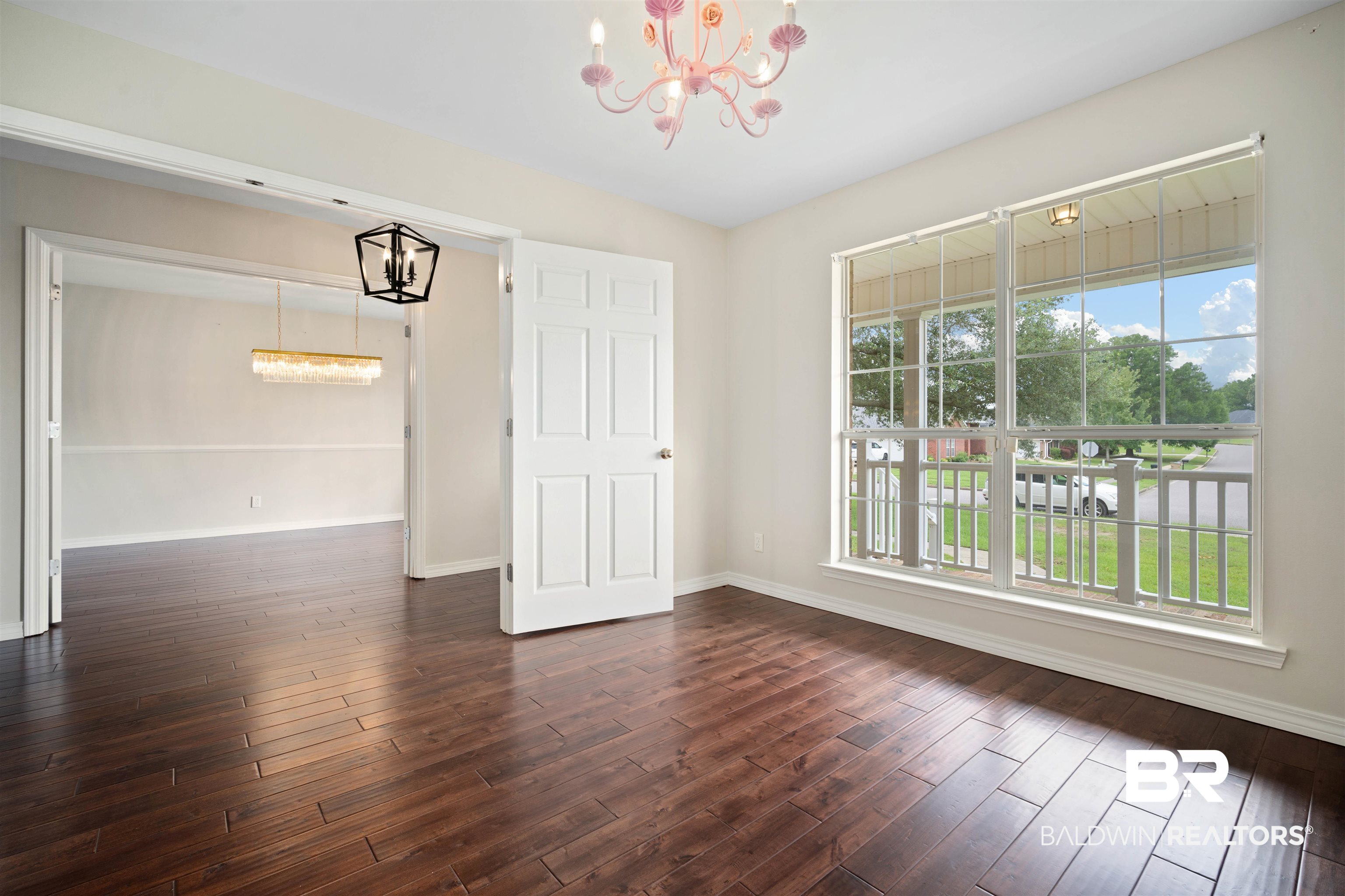 4000 Fenwick Loop Mobile, AL 36619 - Photo 14 of 31 Spare room featuring a chandelier and dark wood finished floors