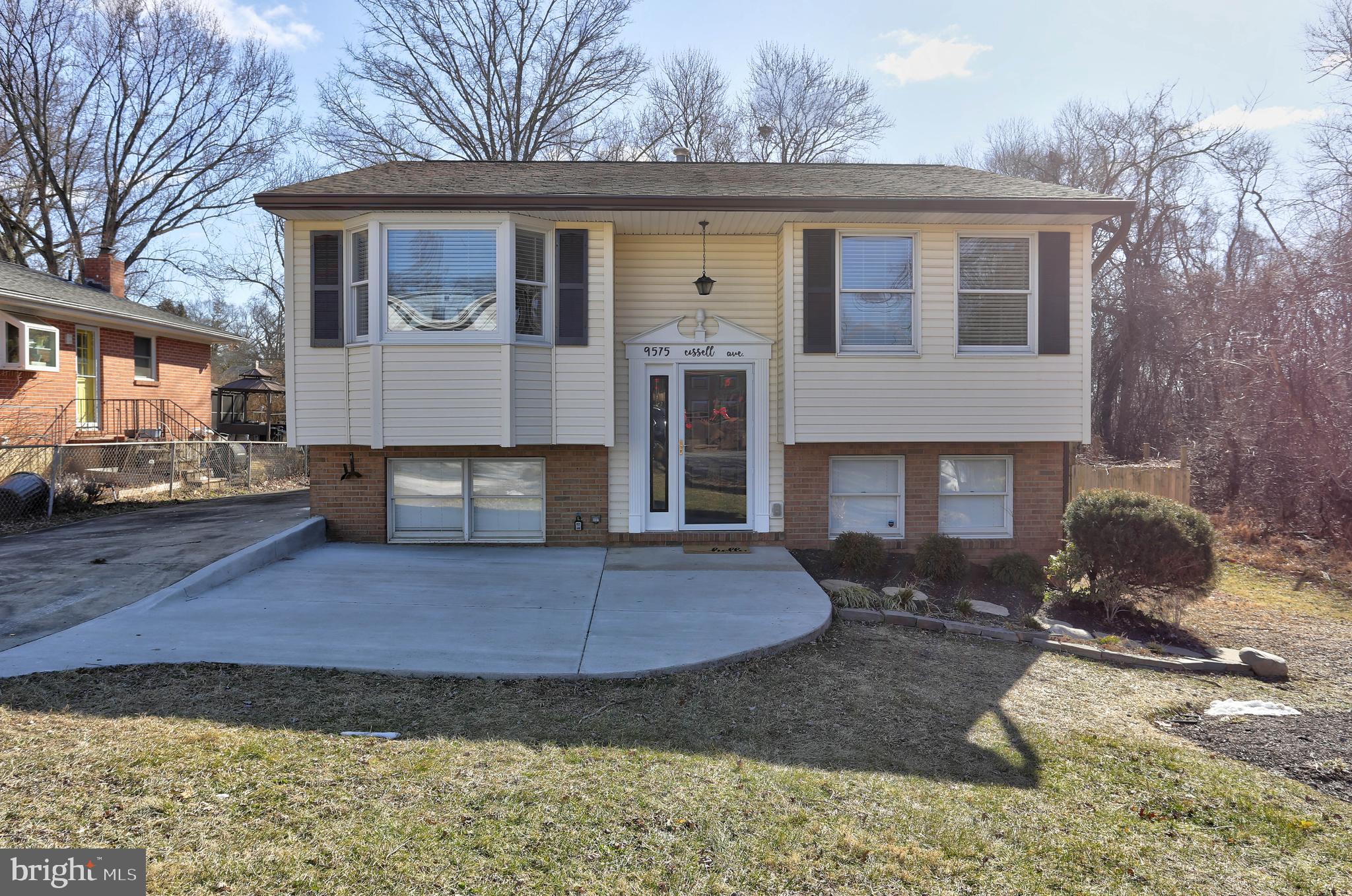 9575 Cissell Avenue Laurel, MD 20723 - Photo 1 of 34 a front view of a house with a yard and garage