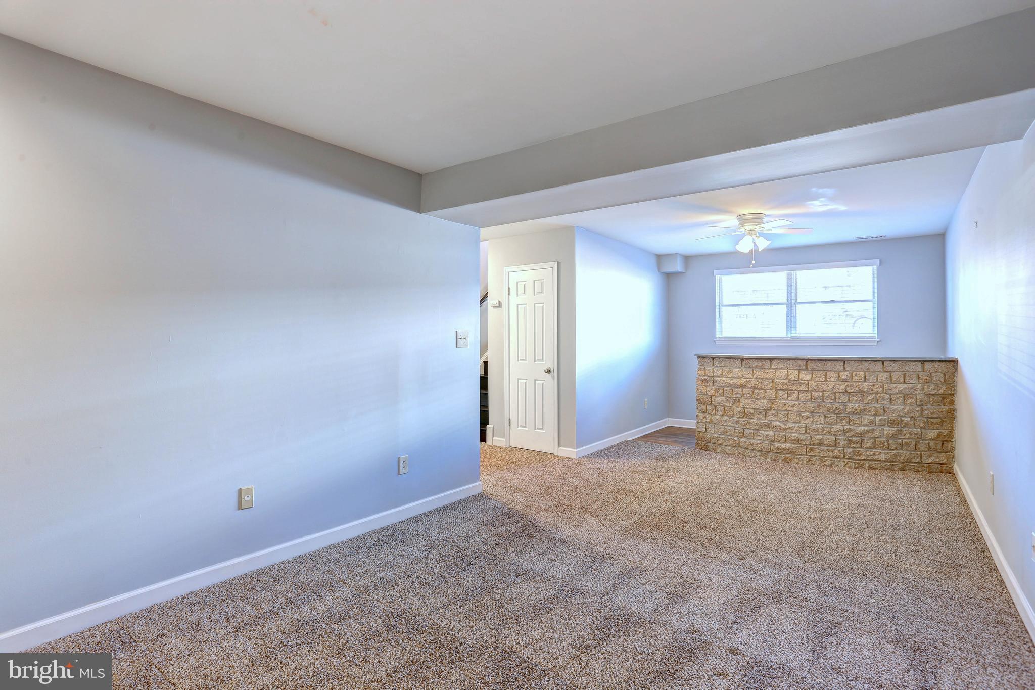 9575 Cissell Avenue Laurel, MD 20723 - Photo 17 of 34 a view of an empty room with a window