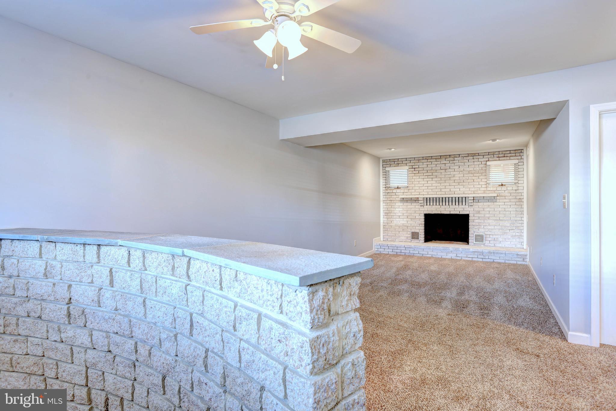 9575 Cissell Avenue Laurel, MD 20723 - Photo 18 of 34 a view of an empty room with a chandelier fan