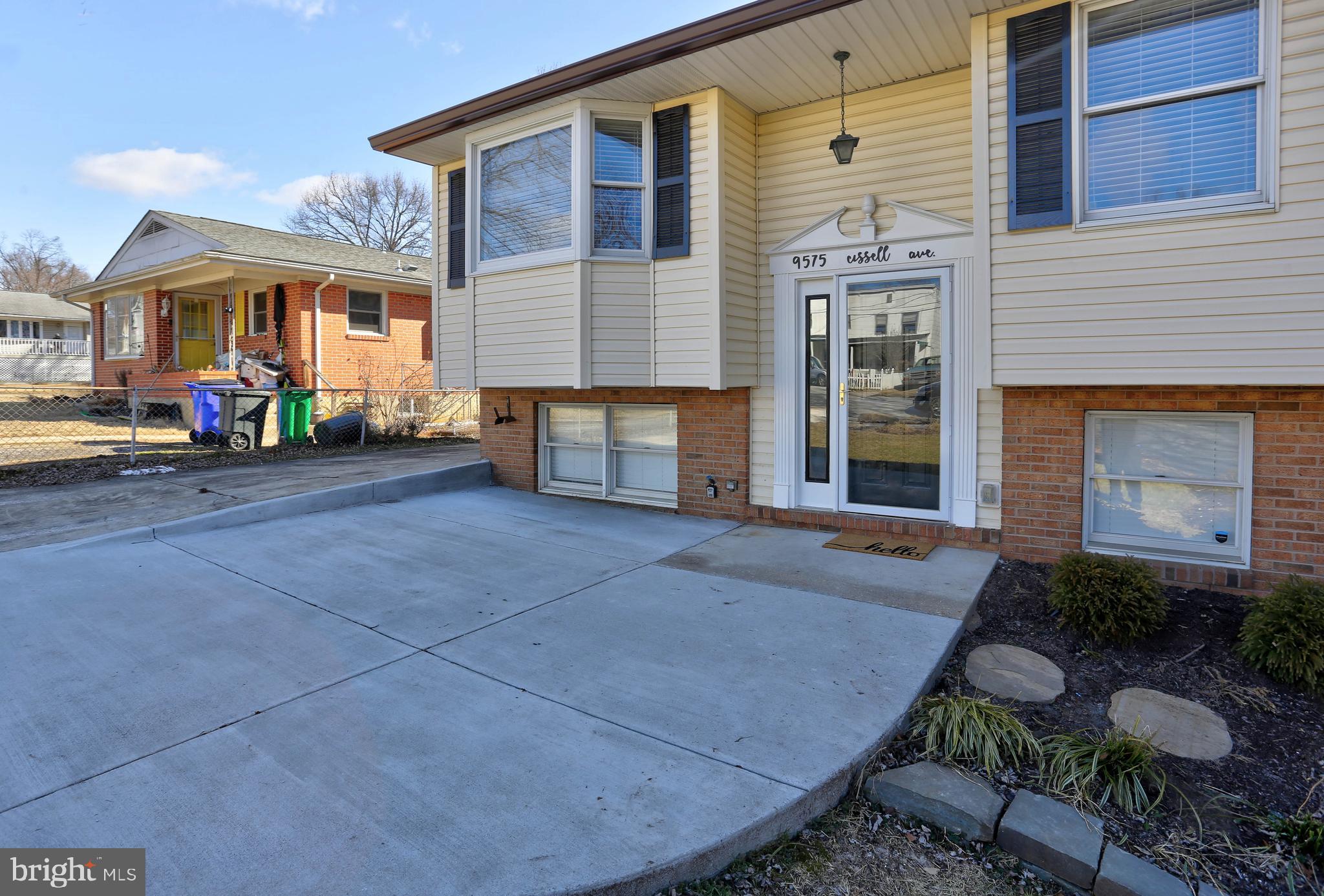 9575 Cissell Avenue Laurel, MD 20723 - Photo 24 of 34 a front view of a house with garden