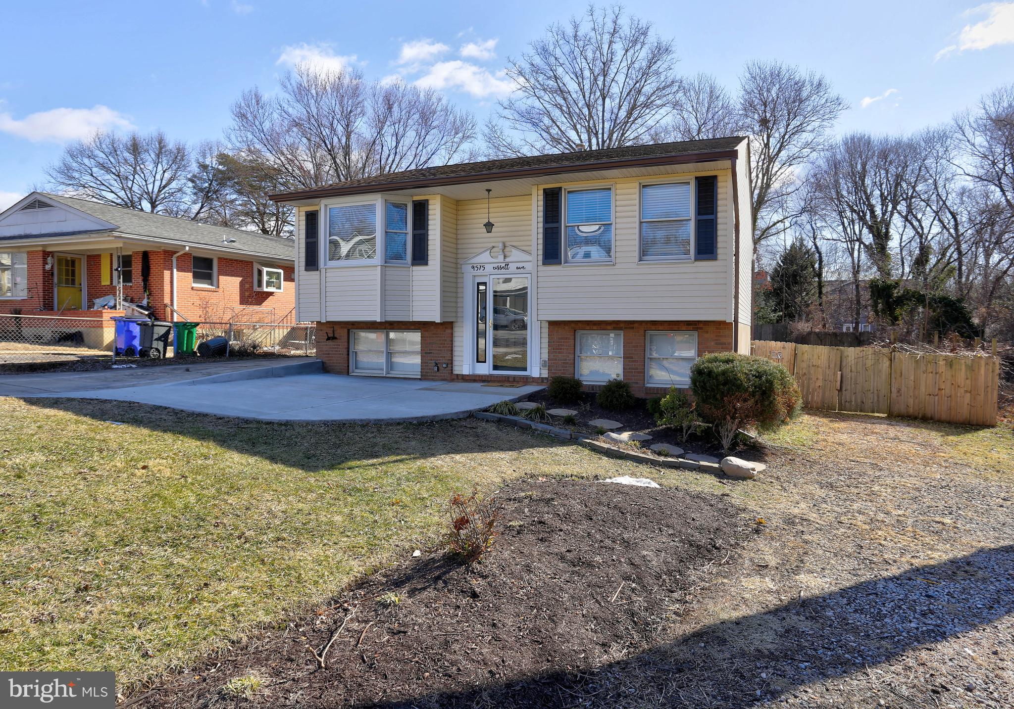 9575 Cissell Avenue Laurel, MD 20723 - Photo 25 of 34 a view of a house with a yard covered in snow
