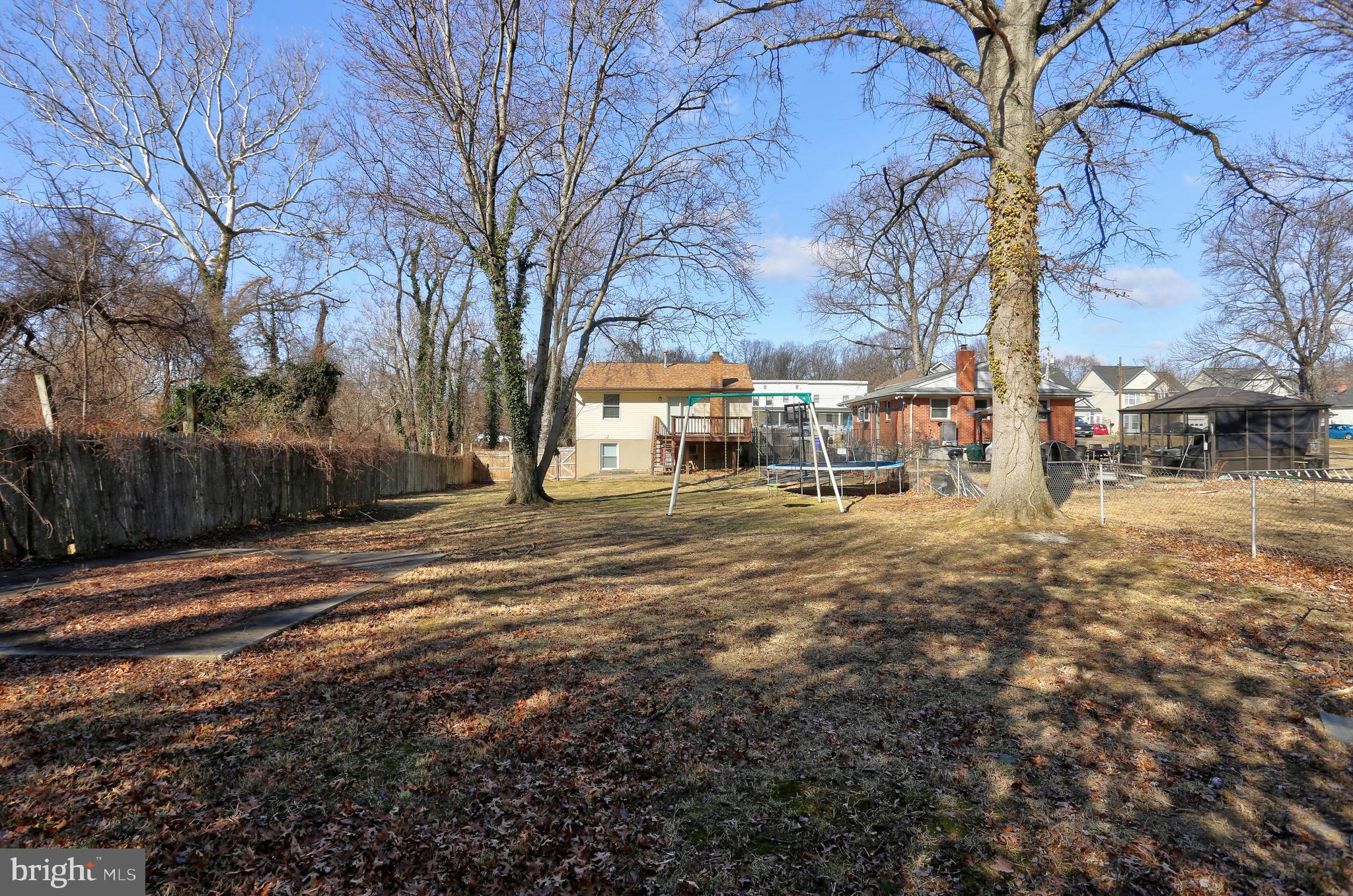 9575 Cissell Avenue Laurel, MD 20723 - Photo 30 of 34 a view of road with large trees