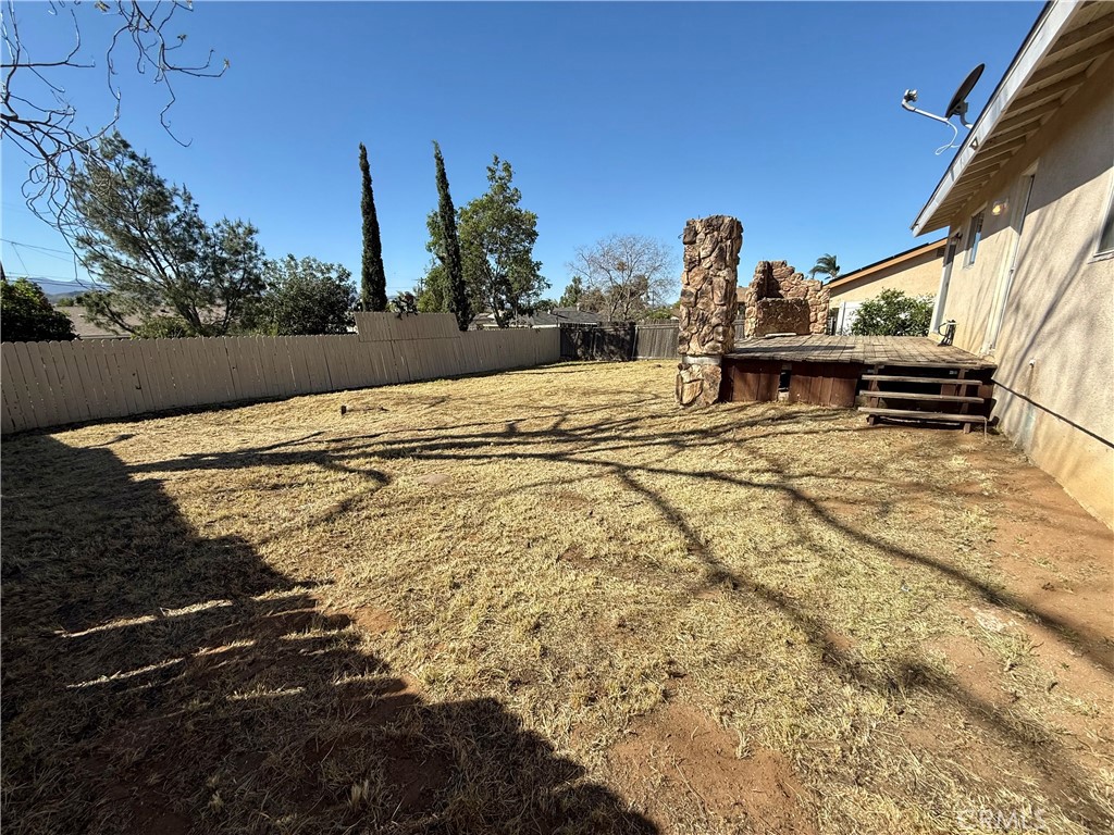 9920 Jurupa Road Jurupa Valley, CA 92509 - Photo 9 of 13 a view of a terrace with wooden fence
