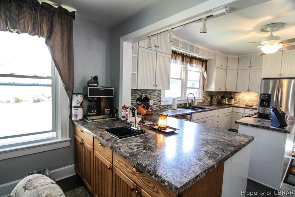 18 Browns Store Road Heathsville, VA 22473 - Photo 20 of 42 a kitchen with a stove a sink a refrigerator and a counter top space