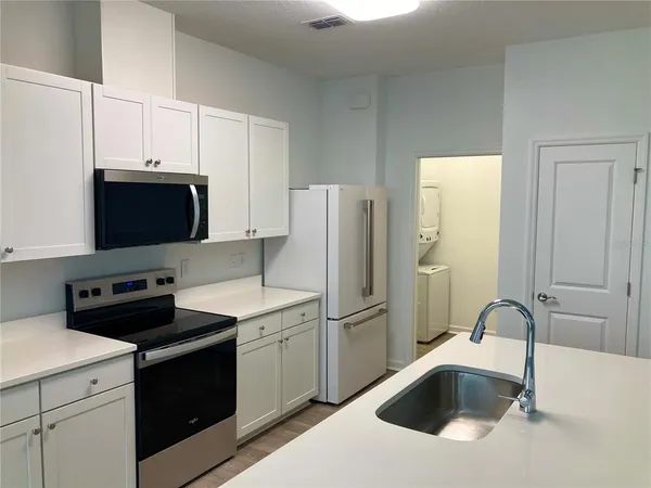 a bathroom with a sink double vanity and a mirror