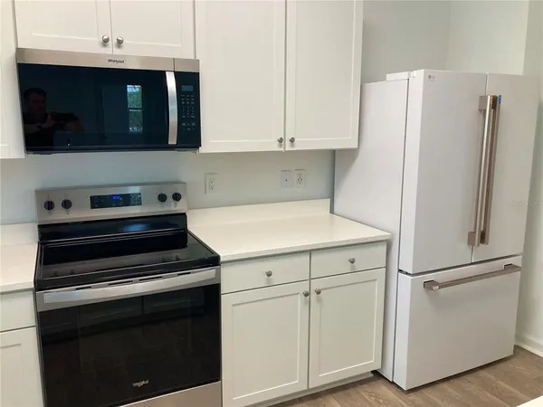 a kitchen with a sink and cabinets
