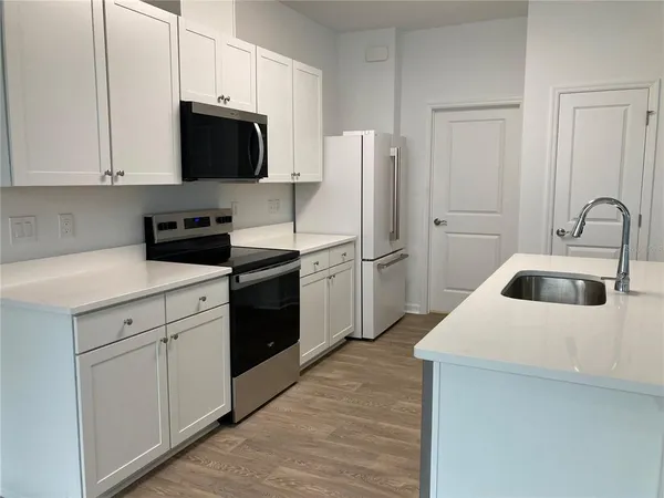 a bathroom with a shower and a glass door
