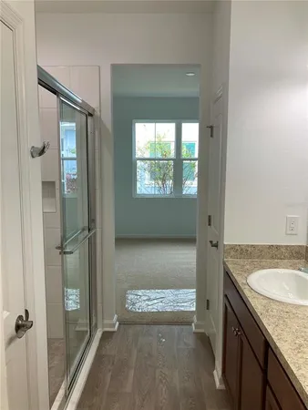 an aerial view of residential houses with outdoor space and river