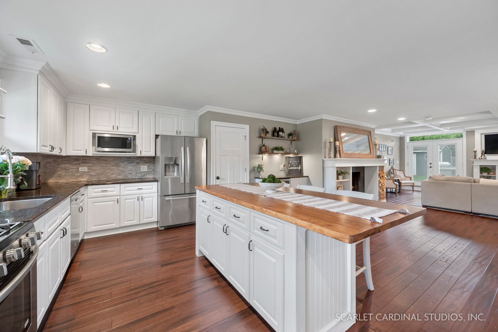 432 Countryside Drive Wheaton, IL 60187 - Photo 5 of 29 a kitchen with stainless steel appliances granite countertop a stove refrigerator and cabinets