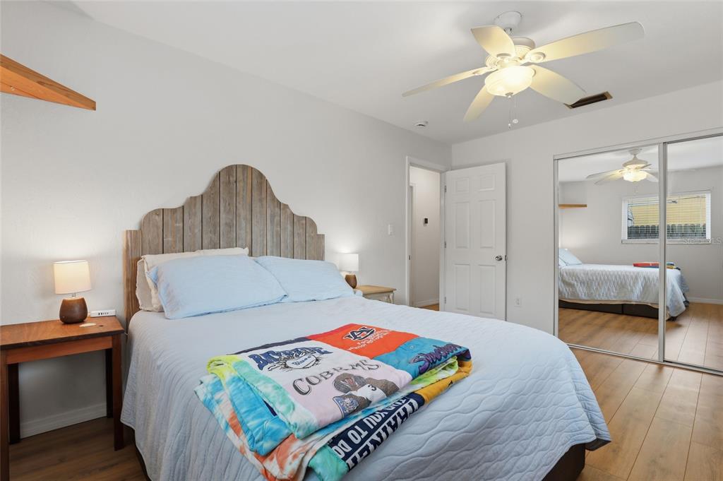 4576 Bliss Road Sarasota, FL 34233 - Photo 22 of 40 a bed room with a bed and a chandelier