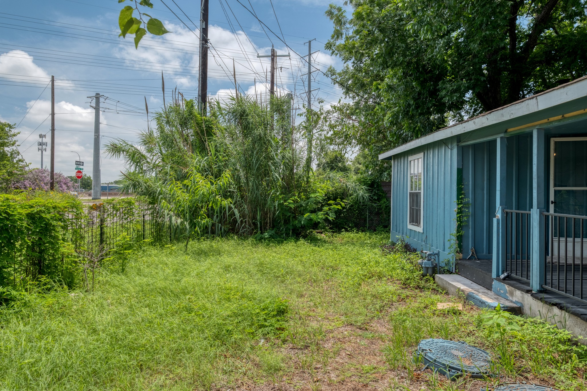 6409 Del Monte Road Austin, TX 78741 - Photo 3 of 15 A quaint backyard offers natural landscaping and a private outdoor space.