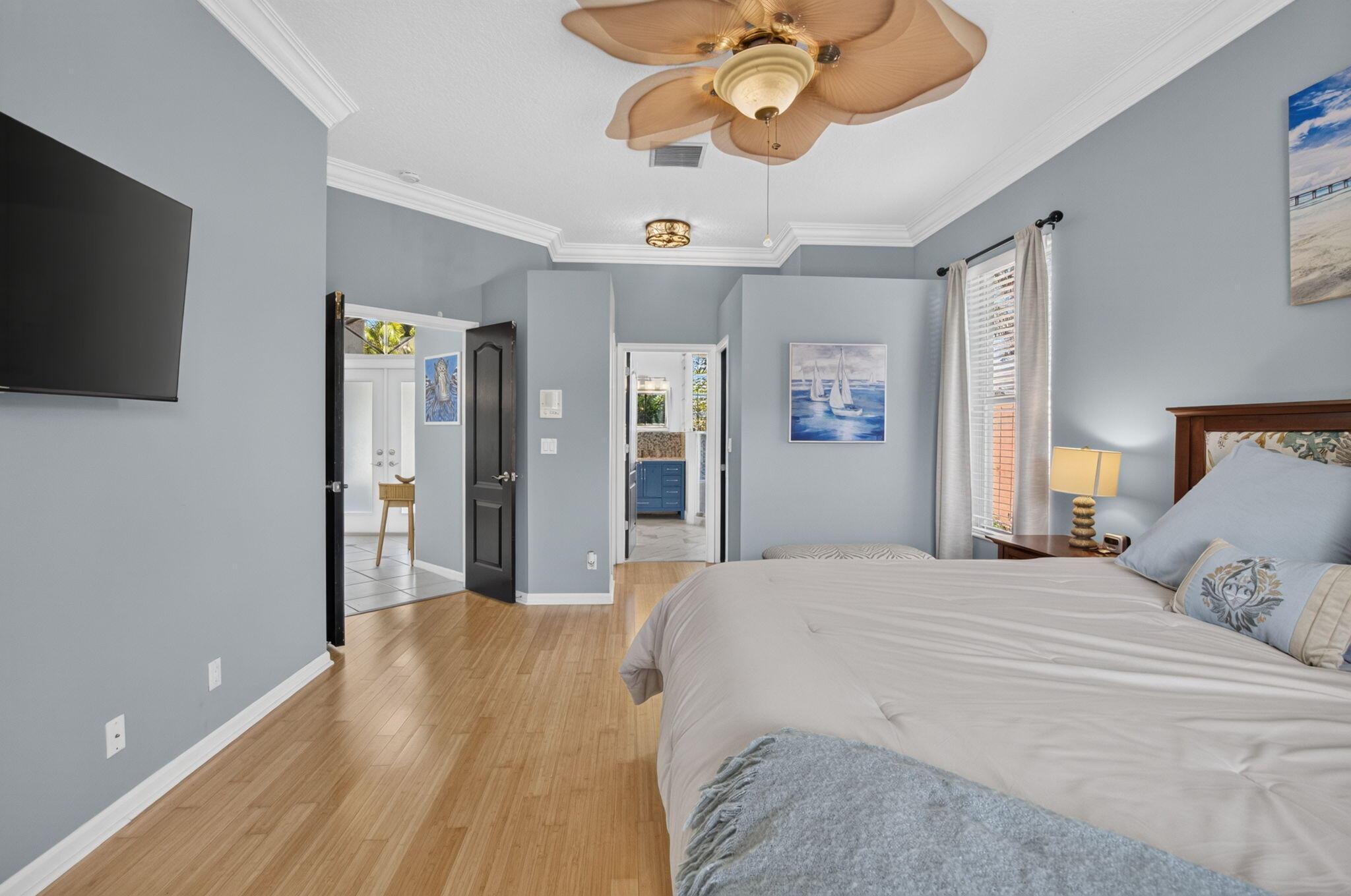 1365 East Barwick Ranch Circle Delray Beach, FL 33445 - Photo 20 of 77 a bedroom with a bed and a flat screen tv