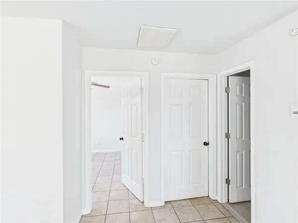 a view of a ceiling fan and a window