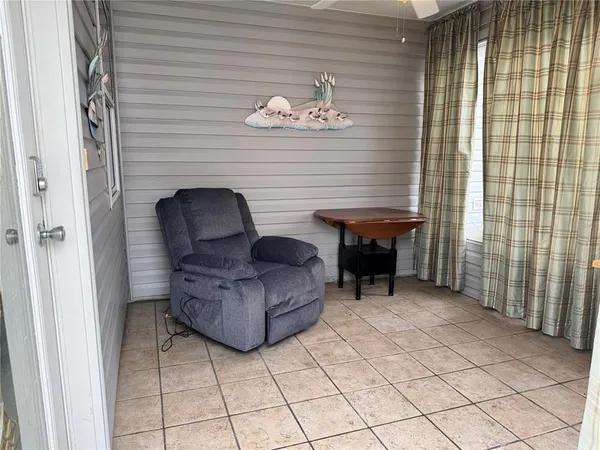 a view of livingroom with furniture and a window