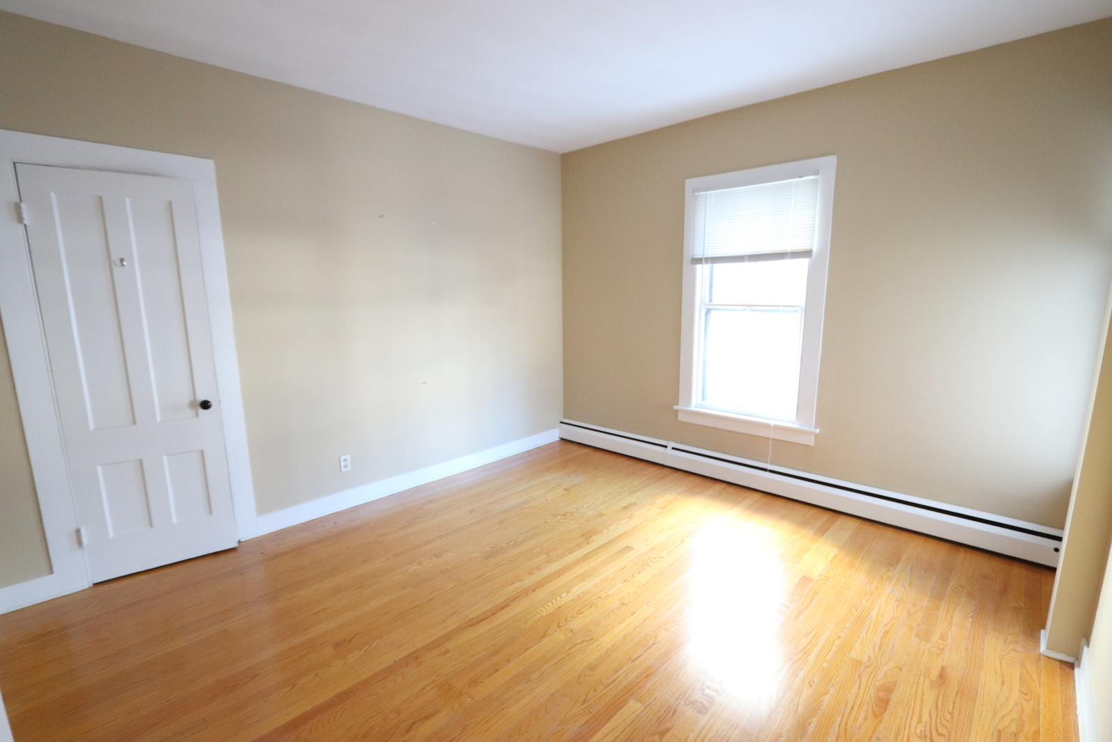 72 North Whittlesey Avenue, Unit 1 Wallingford, CT 06492 - Photo 10 of 11 wooden floor in an empty room with a window