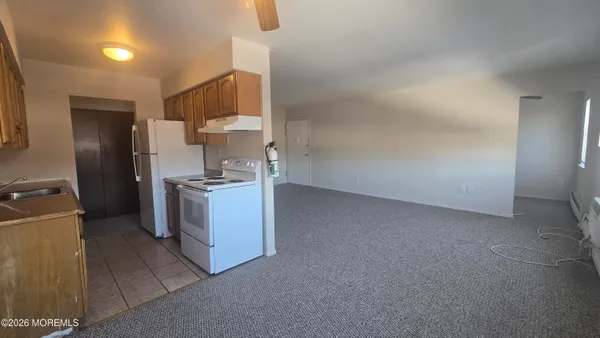 a kitchen with a sink cabinets and stainless steel appliances