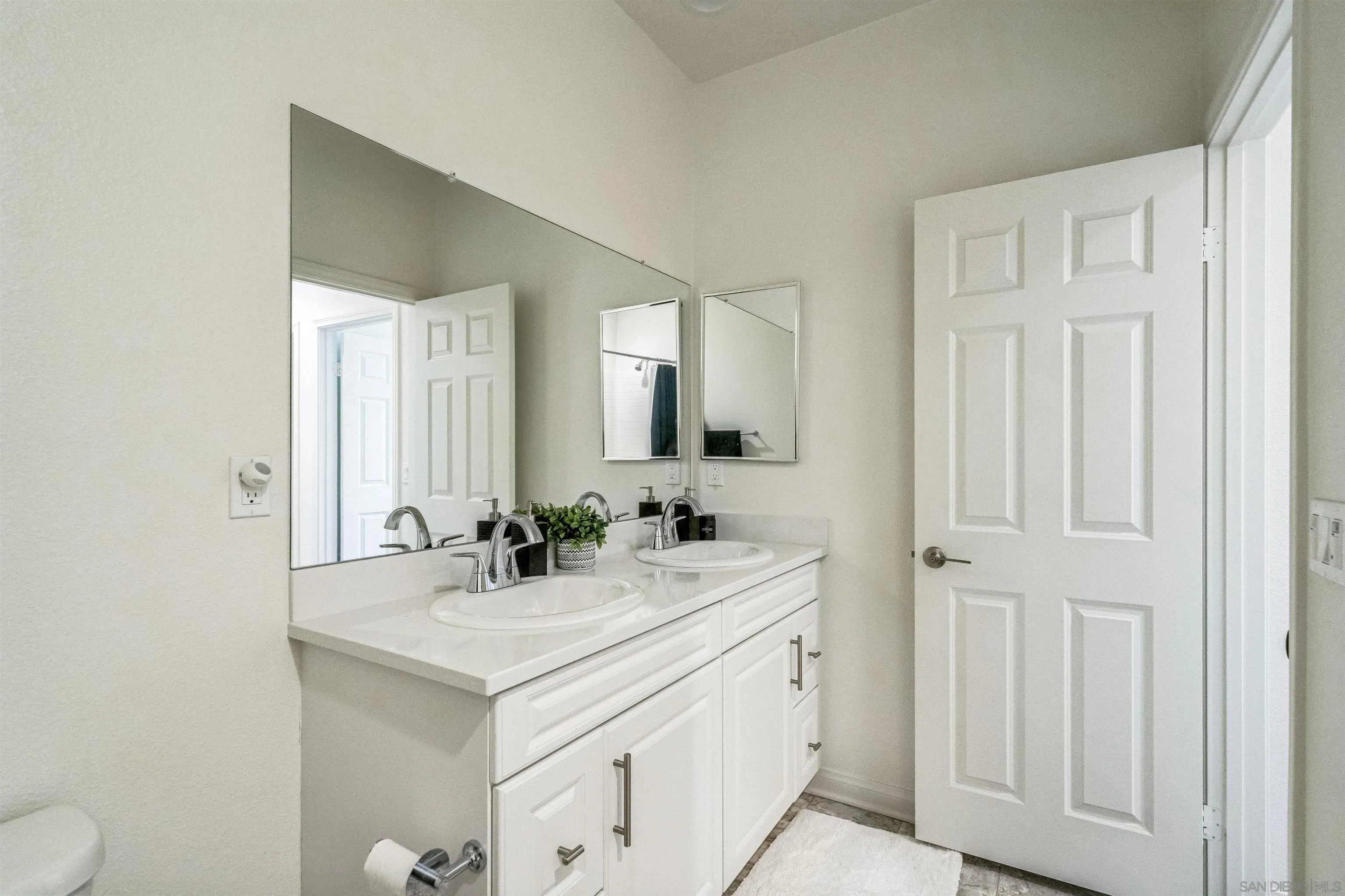 2018 Barite Street Spring Valley, CA 91977 - Photo 29 of 47 a bathroom with a sink and a mirror