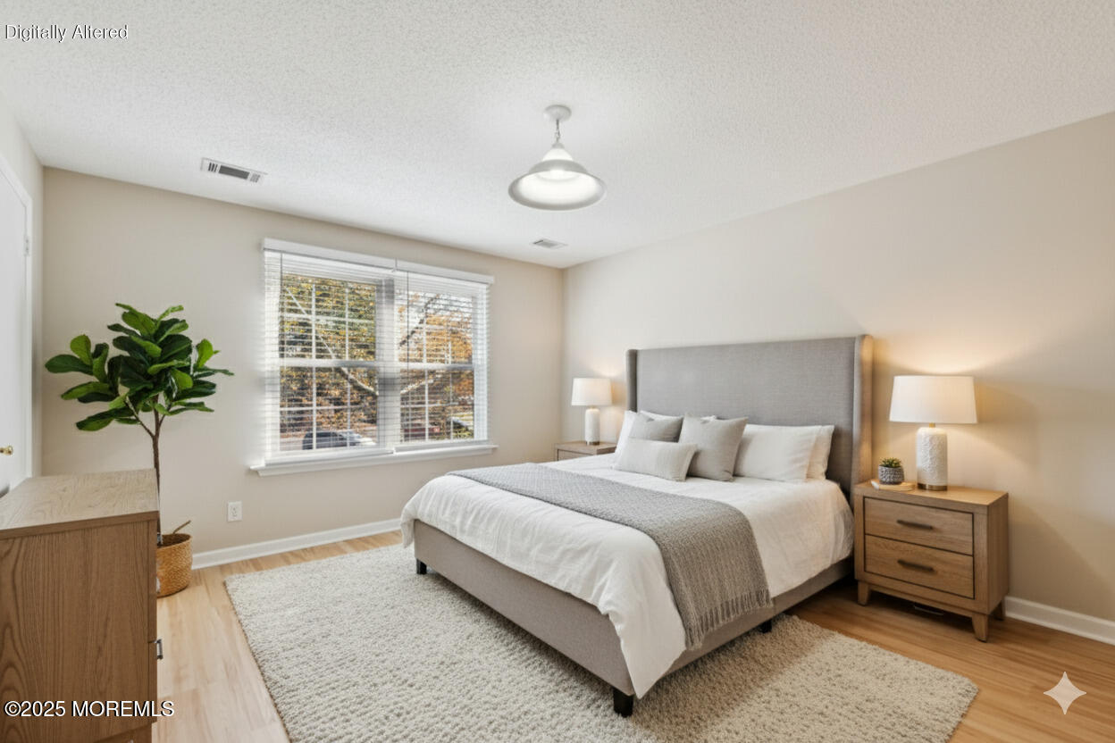20-3 Austin Court, Unit 7 Freehold, NJ 07728 - Photo 19 of 31 a bedroom with a bed and a window