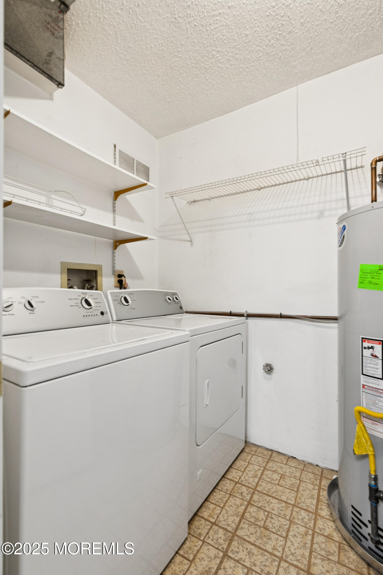 20-3 Austin Court, Unit 7 Freehold, NJ 07728 - Photo 28 of 31 a utility room with dryer and washer