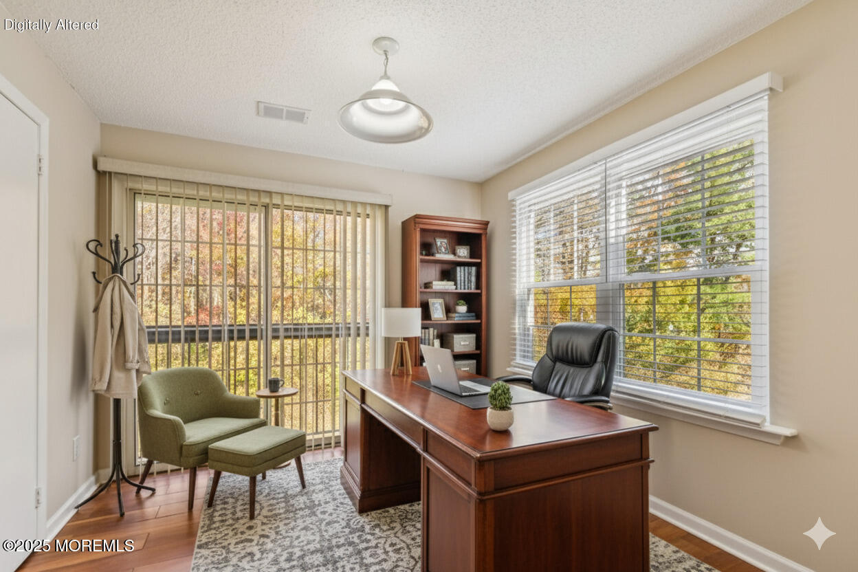20-3 Austin Court, Unit 7 Freehold, NJ 07728 - Photo 3 of 31 a view of a workspace with furniture and a window