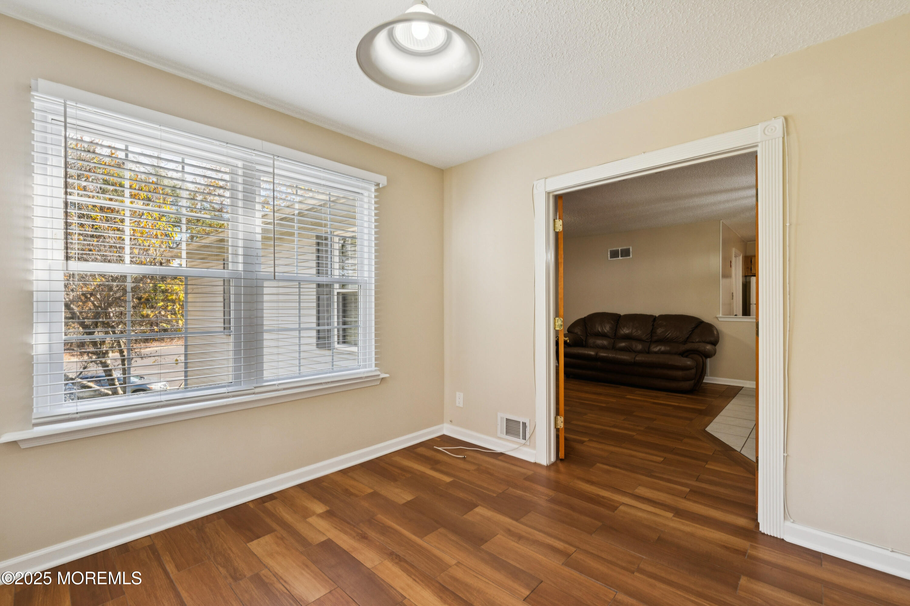 20-3 Austin Court, Unit 7 Freehold, NJ 07728 - Photo 5 of 31 a view of livingroom with furniture and window