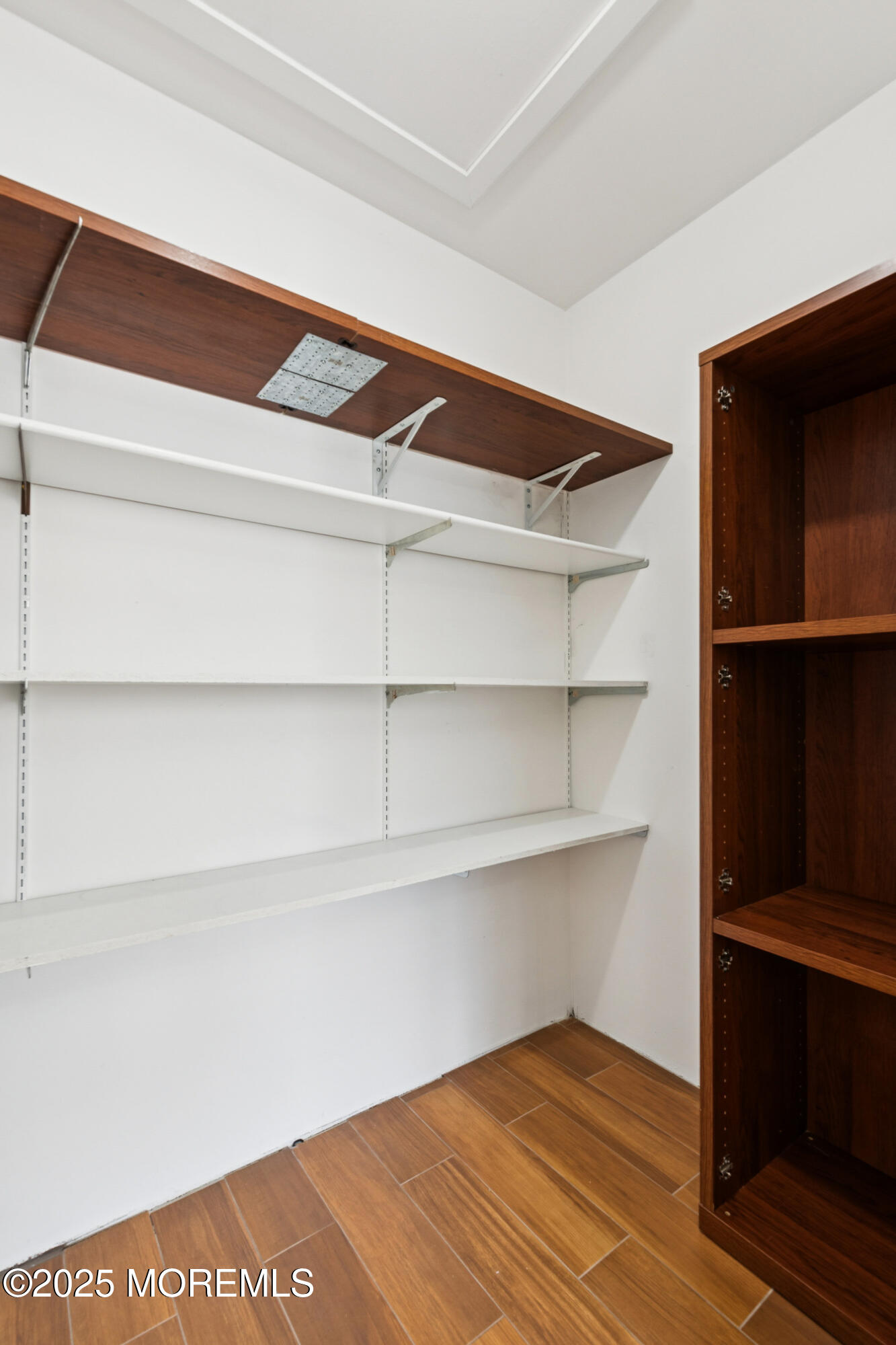 20-3 Austin Court, Unit 7 Freehold, NJ 07728 - Photo 6 of 31 a view of an empty walk in closet