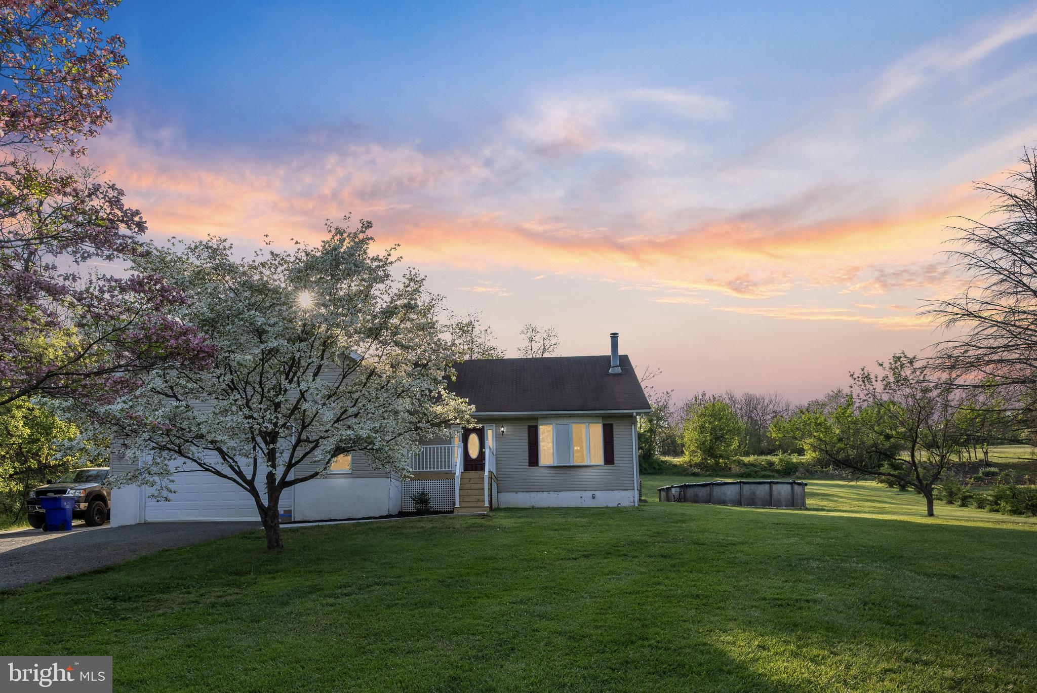 133 Roop Road Rising Sun, MD 21911 - Photo 1 of 58 a view of a big house with a big yard and large trees
