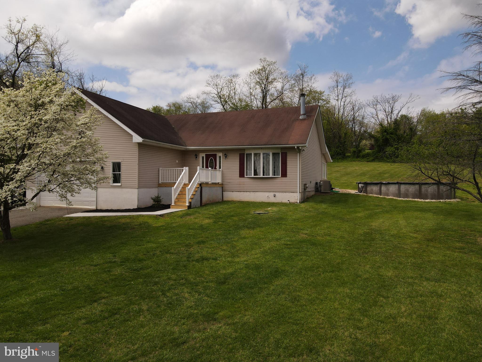 133 Roop Road Rising Sun, MD 21911 - Photo 2 of 58 a front view of house with yard and green space