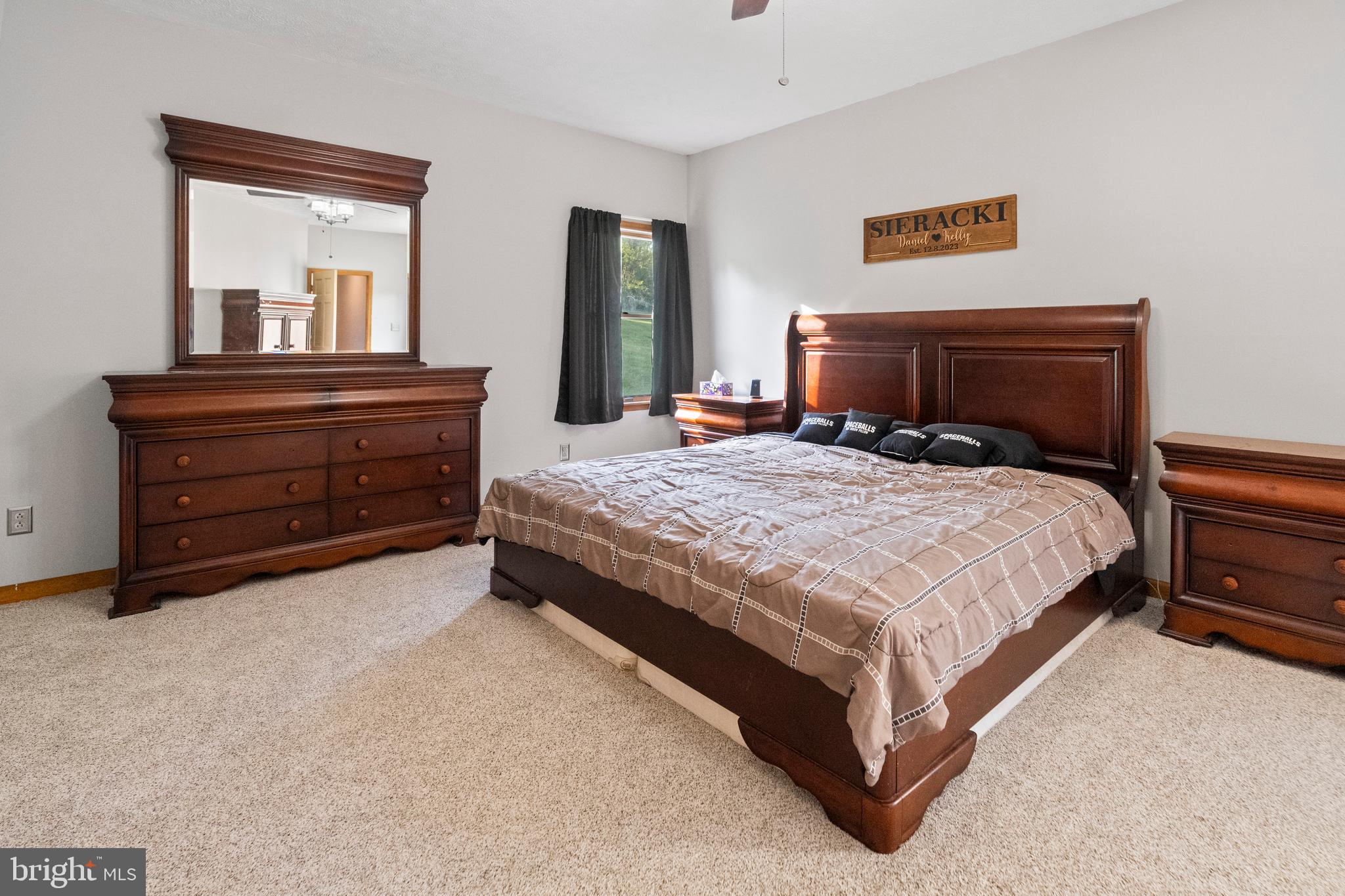 133 Roop Road Rising Sun, MD 21911 - Photo 21 of 58 a bedroom with a bed and a dresser