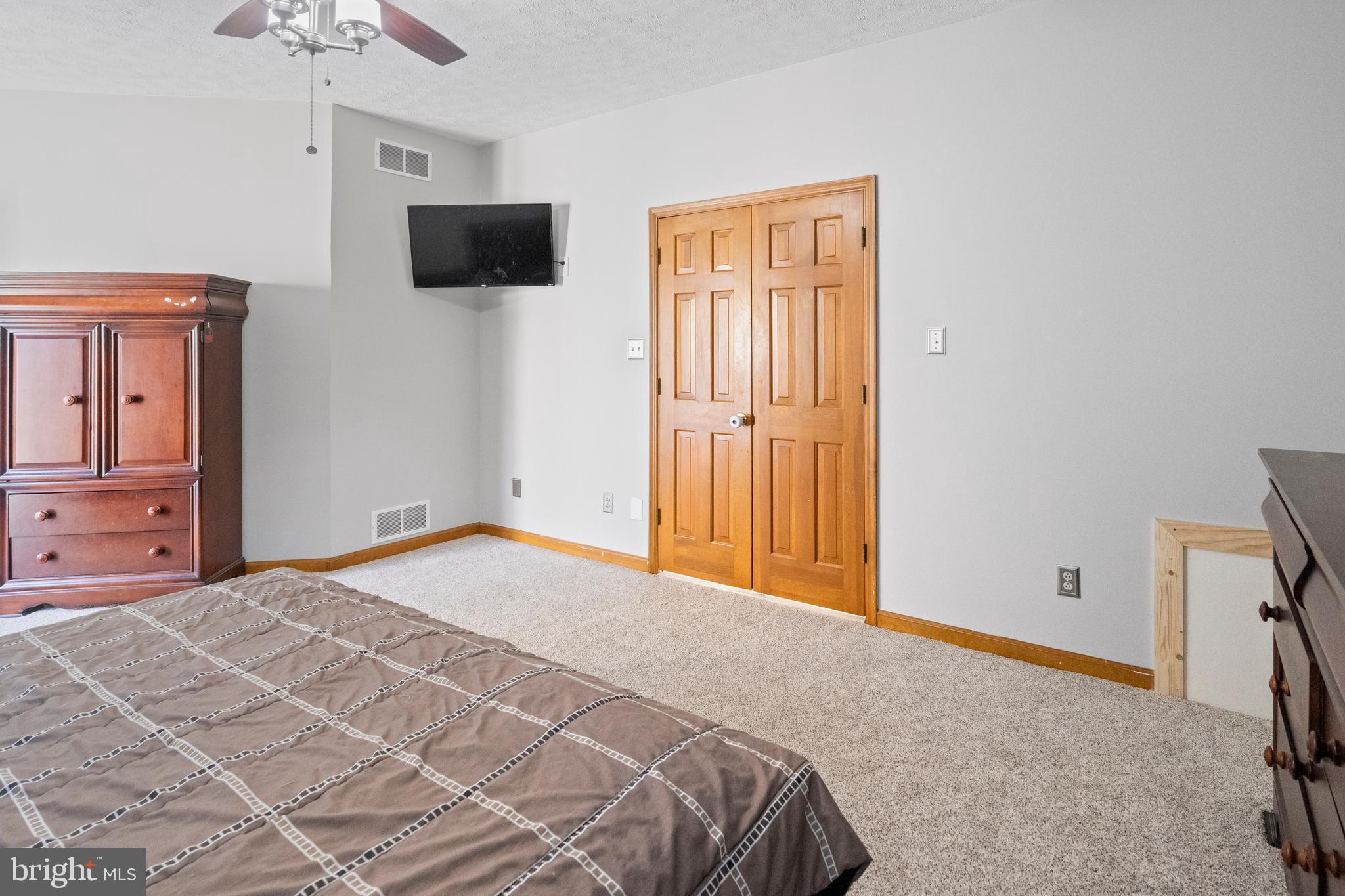 133 Roop Road Rising Sun, MD 21911 - Photo 22 of 58 a bedroom with a bed and a flat screen tv