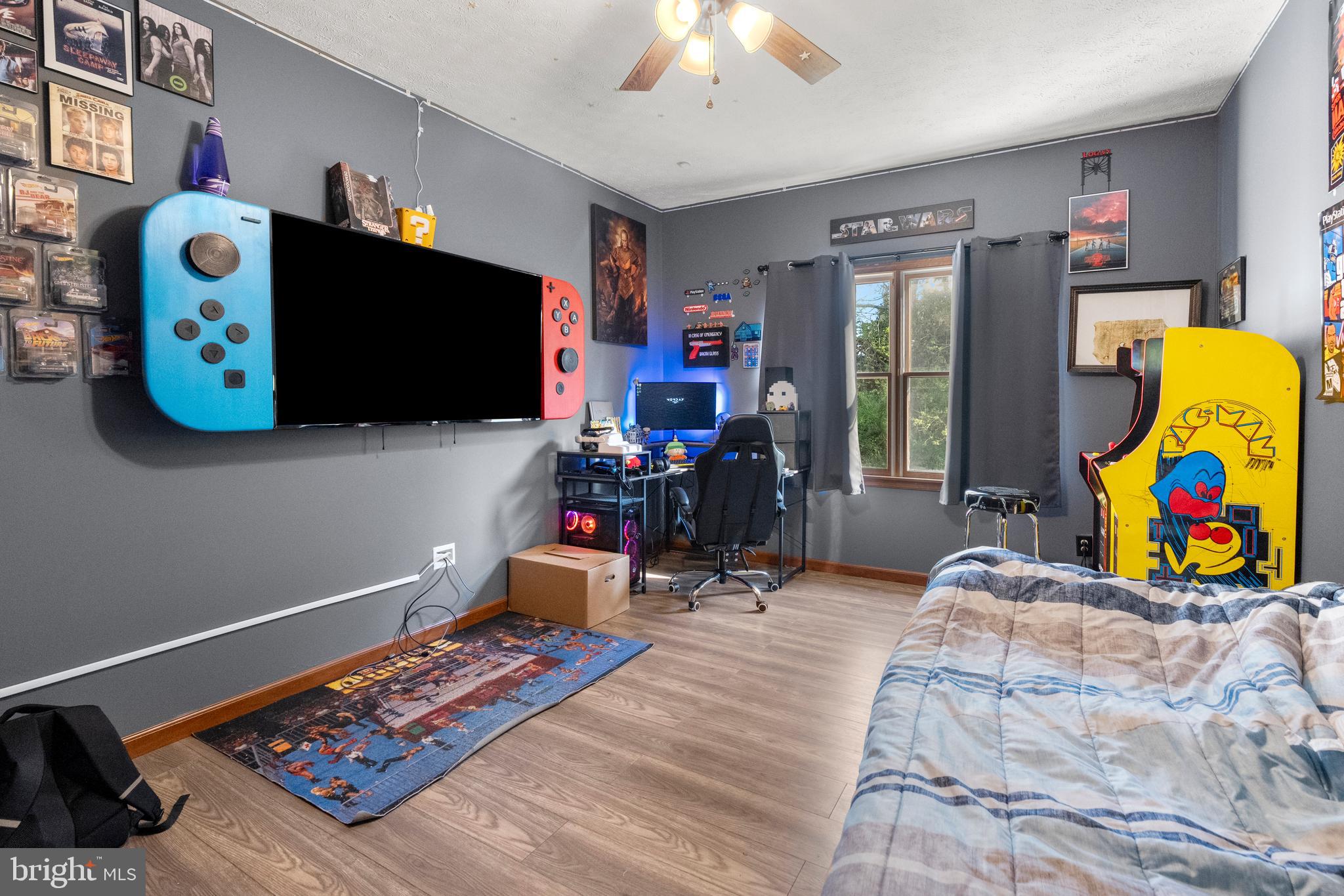 133 Roop Road Rising Sun, MD 21911 - Photo 24 of 58 a living room with furniture and a flat screen tv