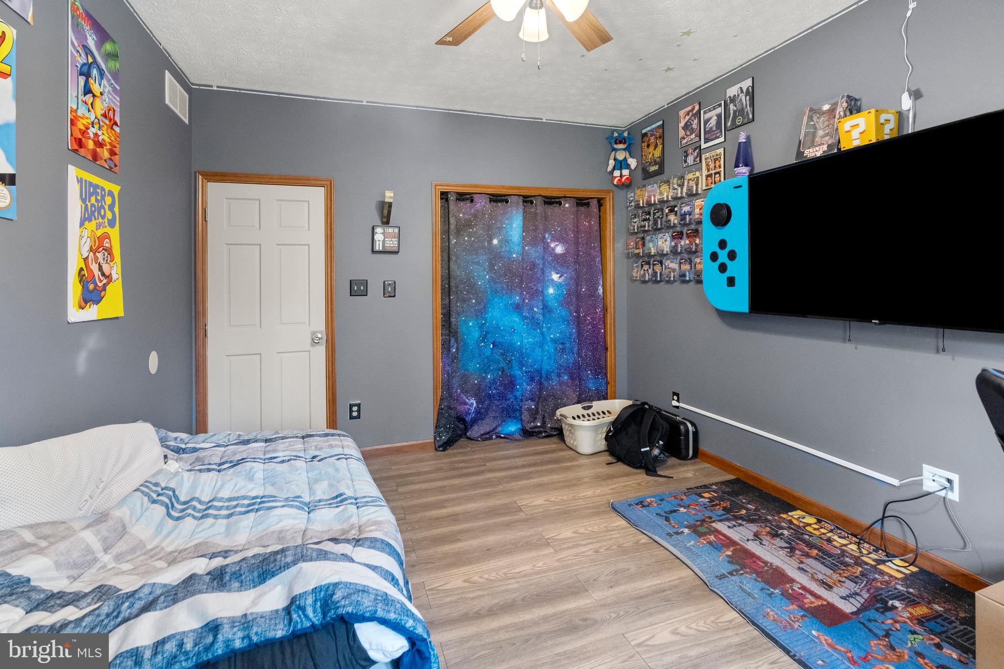 133 Roop Road Rising Sun, MD 21911 - Photo 25 of 58 a bedroom with bed and a flat screen tv