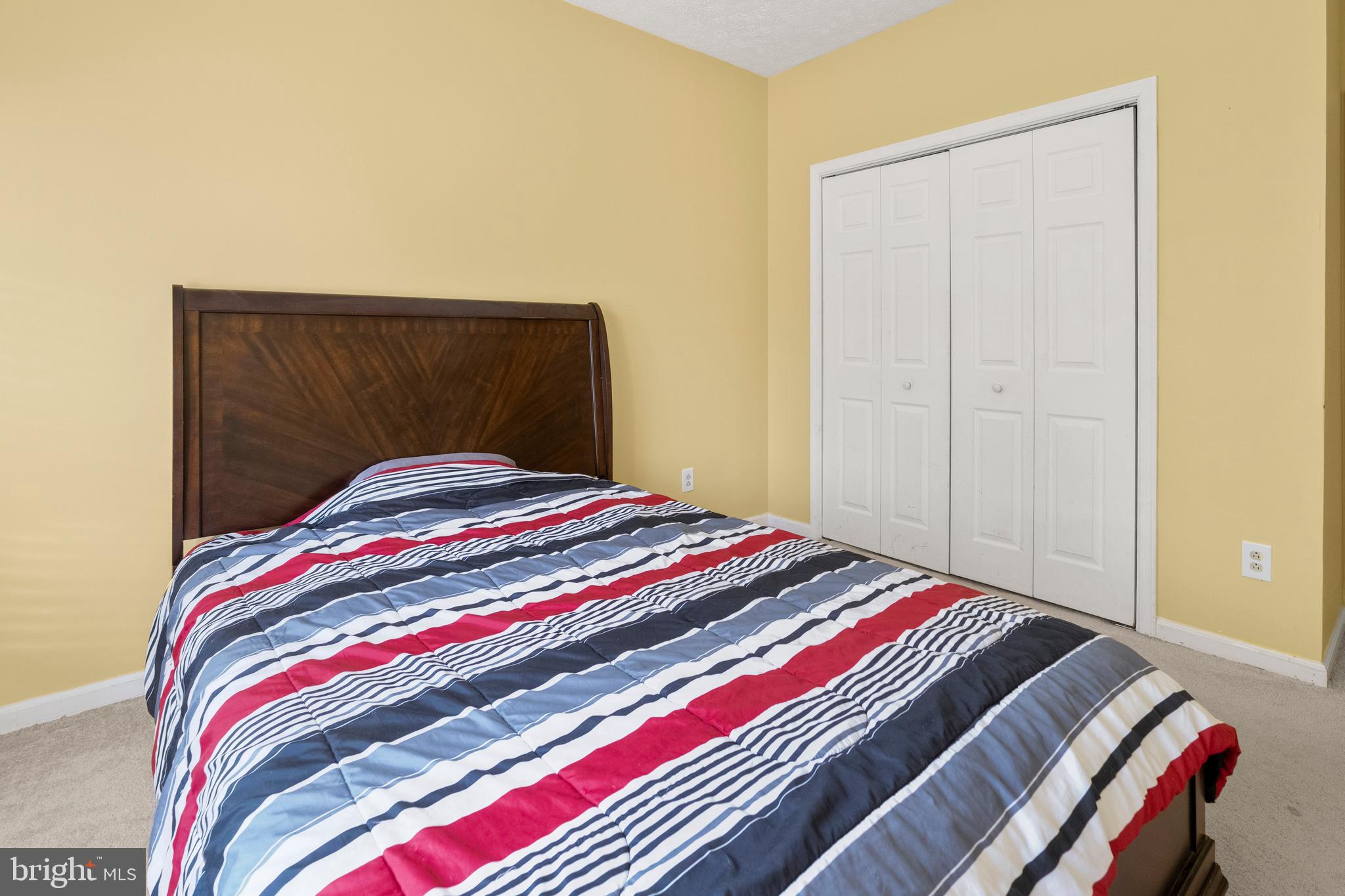 133 Roop Road Rising Sun, MD 21911 - Photo 27 of 58 a bedroom with a bed and a painting on the wall