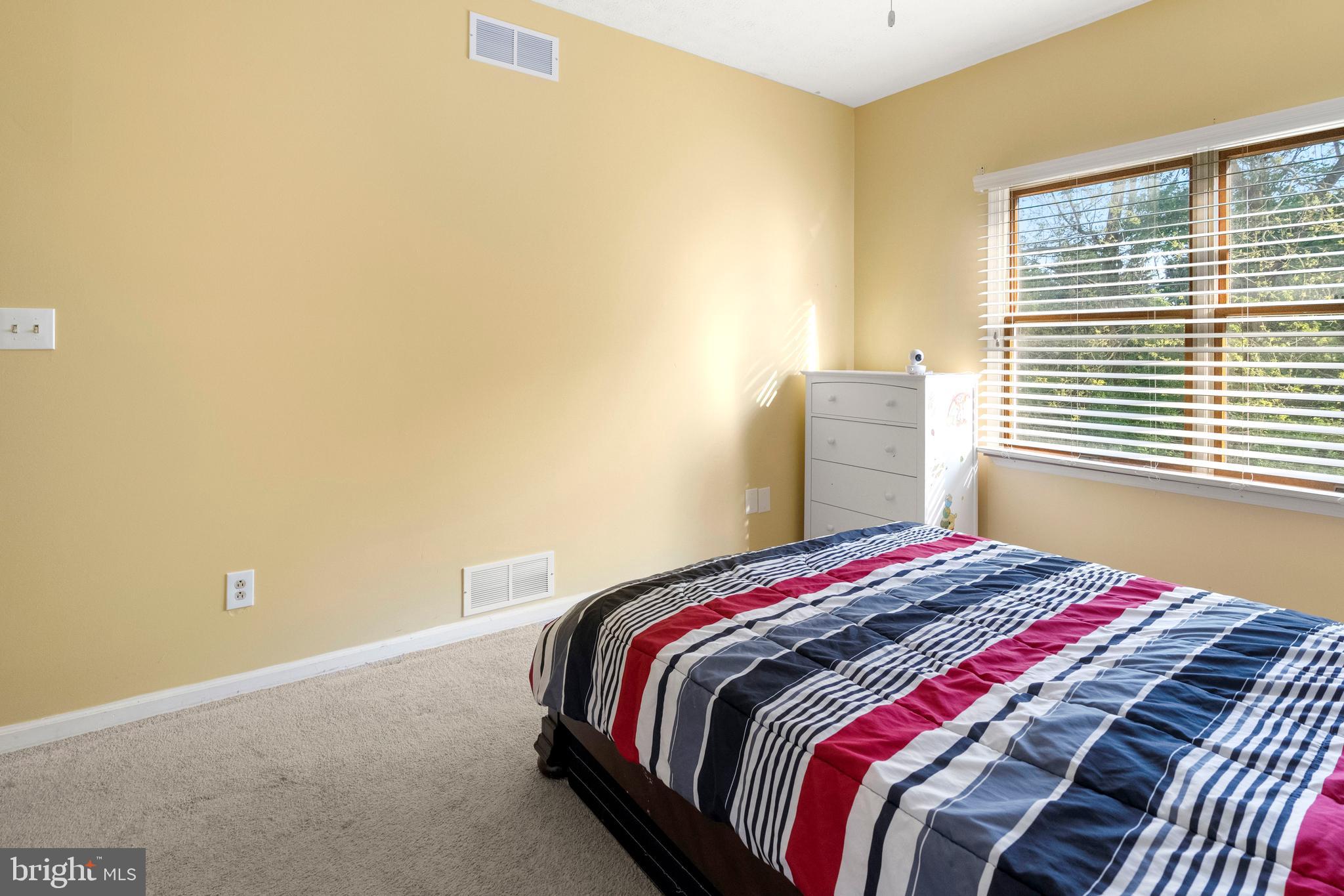 133 Roop Road Rising Sun, MD 21911 - Photo 28 of 58 a bedroom with a bed and a window