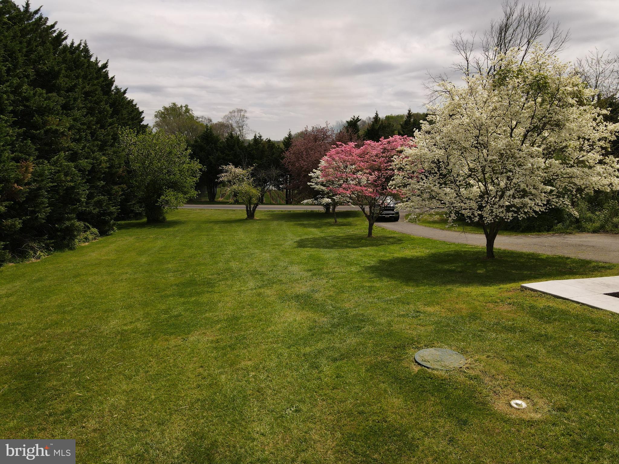 133 Roop Road Rising Sun, MD 21911 - Photo 58 of 58 a view of a garden with a house in the background