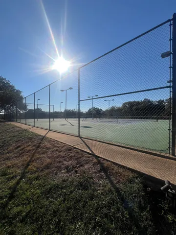 a view of a patio with a table and chairs