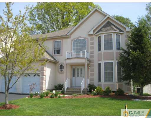 12 Timber Ridge Road North Brunswick, NJ 08902 - Photo 1 of 9 front view of a house with a yard