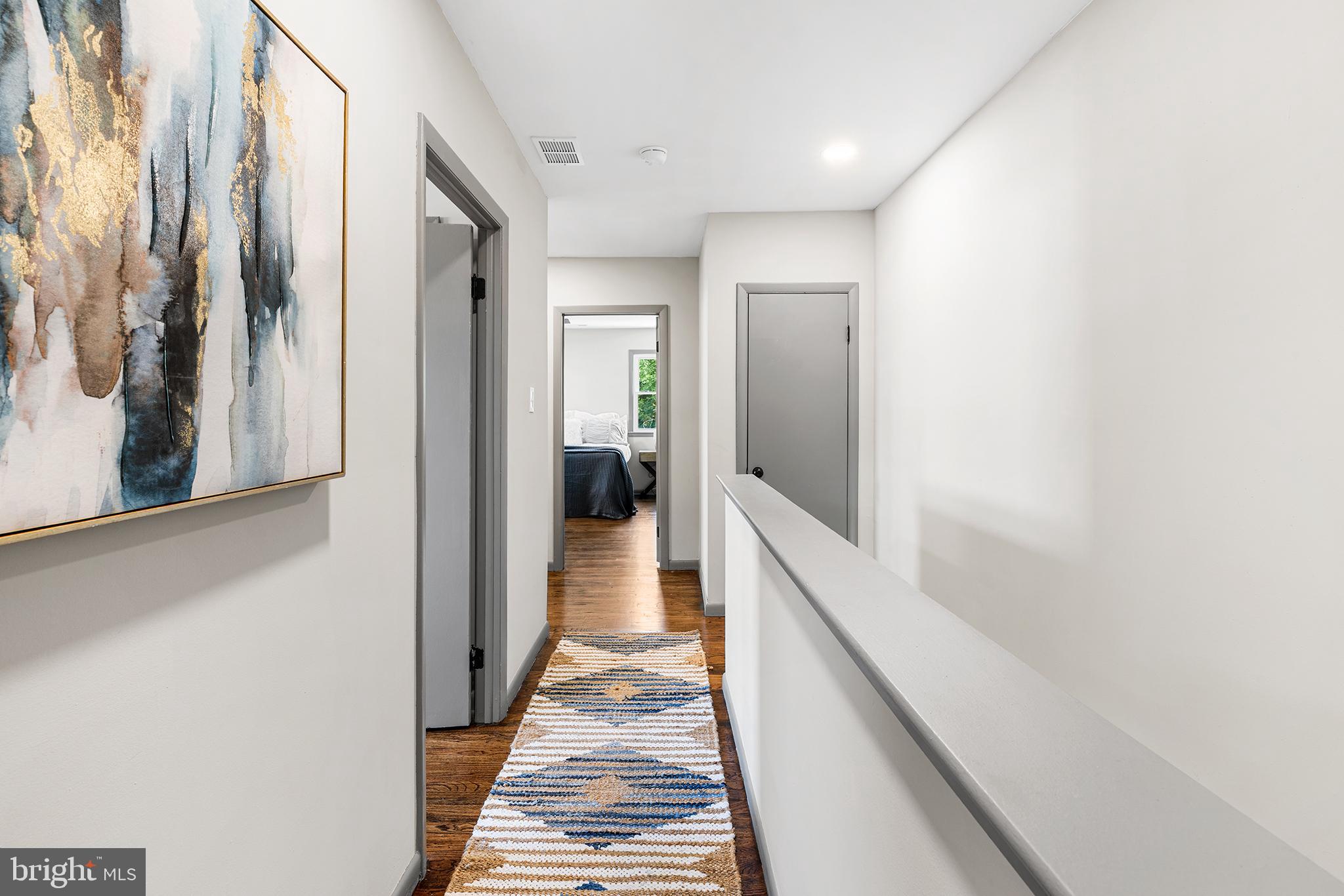 26 Virginia Circle Ridley Park, PA 19078 - Photo 23 of 49 a hallway with white doors wooden floor and stairs