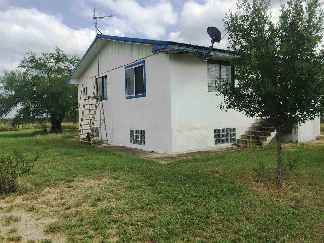 379 Well Lane Laredo, TX 78045 - Photo 13 of 20 a white house that has tree in front of it
