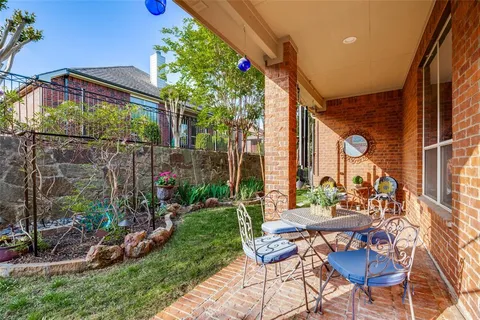 a view of an chairs and table in the patio