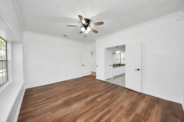 a bathroom with a tub a sink and a shower