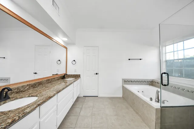 a view of an entryway with wooden floor and a livingroom