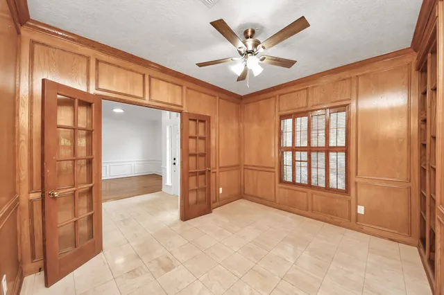 a kitchen with stainless steel appliances granite countertop table chairs sink and cabinets