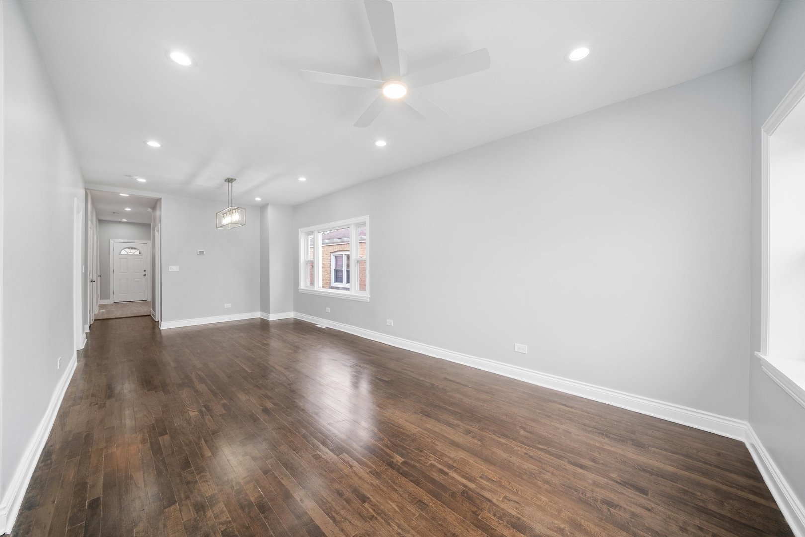 5237 Long Avenue Chicago, IL 60638 - Photo 4 of 41 an empty room with wooden floor and windows