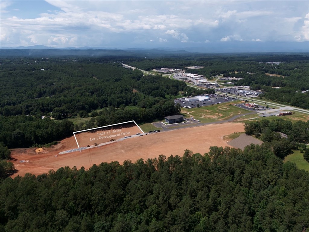 0 Blue Ridge Boulevard West Union, SC 29696 - Photo 9 of 15 An aerial perspective reveals a prime development lot nestled amidst green expanses, offering strategic access to surrounding retail hubs.
