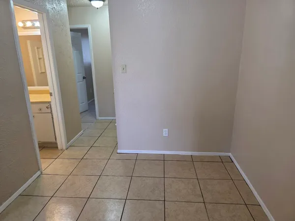 a kitchen with granite countertop a sink and cabinets