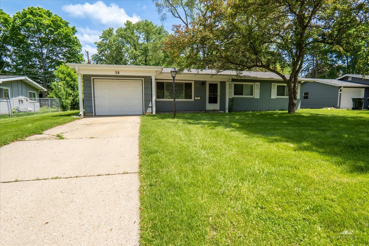 a view of a house with a backyard
