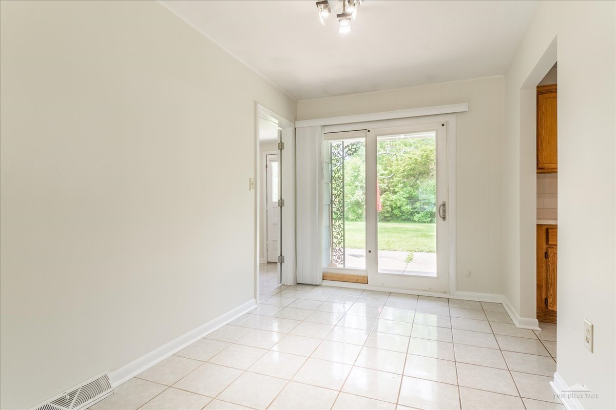 28 Hampton Road Montgomery, IL 60538 - Photo 8 of 27 a view of an empty room with a window